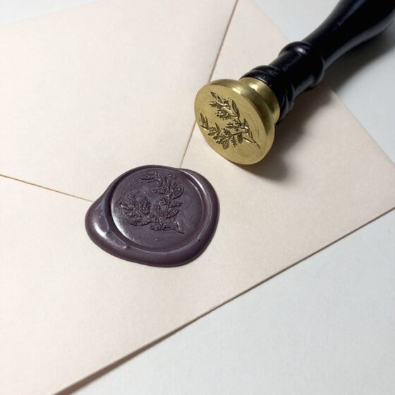 wax seal stamps look great on your wedding invitation envelopes